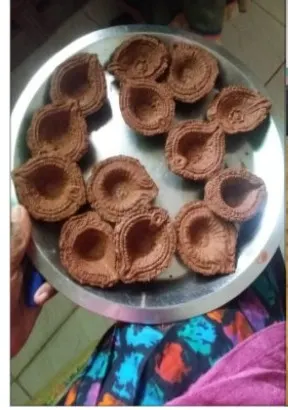 Eco-friendly diyas made by group members.
