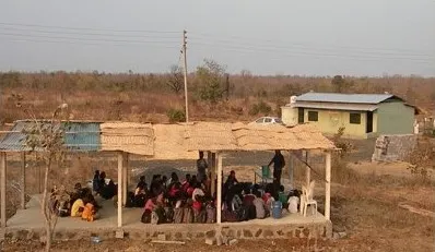 A group session under the open shed at NETRAVAN.